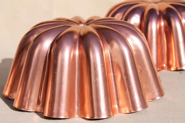 photo of vintage pink aluminum copper jello molds, decorative wall hangers kitchen food mold collection #10