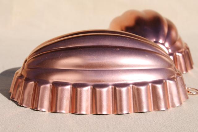 photo of vintage pink aluminum copper jello molds, decorative wall hangers kitchen food mold collection #13