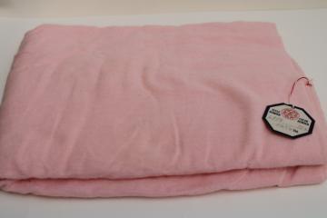 catalog photo of vintage pink cotton flannel fabric w/ original tag, never laundered 26