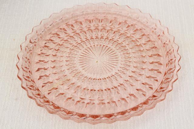 photo of vintage pink depression glass sandwich or cake plate Jeannette holiday buttons and bows pattern #1