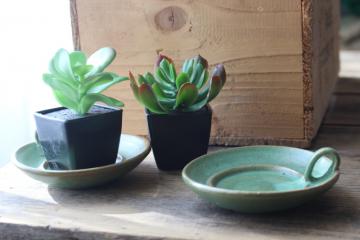 catalog photo of vintage plainsman green matte glaze red clay pottery candle holders or planter dishes