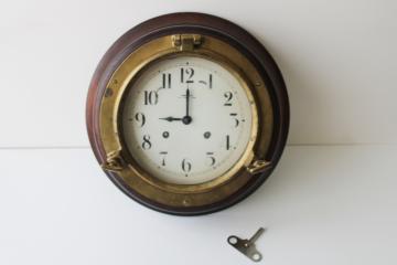 catalog photo of vintage porthole wall clock, solid brass & walnut case, mechanical movement w/ key, Wuersch - Falls River, Mass