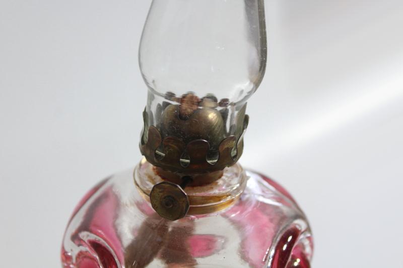 photo of vintage pressed glass oil lamp, bullseye pattern w/ ruby stain color #4