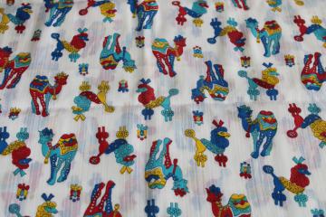 catalog photo of vintage print cotton fabric, drama llama camels & poodles bright colors on crisp white