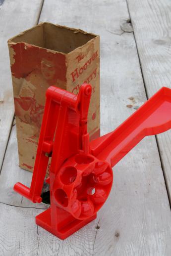 photo of vintage red plastic cherry stoner in original 1940s box, Hoover cherry pitter #1