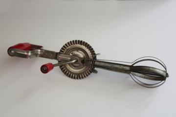 catalog photo of vintage rotary egg beater, hand crank mixer kitchen utensil w/ red painted wood handles