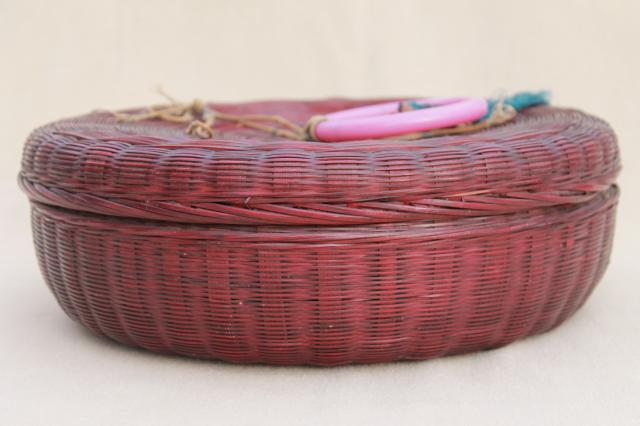 photo of vintage round wicker sewing basket full of spools of colored cotton thread #12