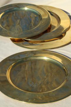 catalog photo of vintage set of four gold charger plates, very heavy solid brass chargers