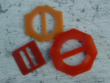 catalog photo of vintage sewing, 1940's buckles, orange catalin bakelite