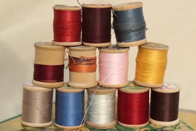 photo of vintage sewing thread on wood spool reels, pure silk & Sylko type mercerized cotton #8