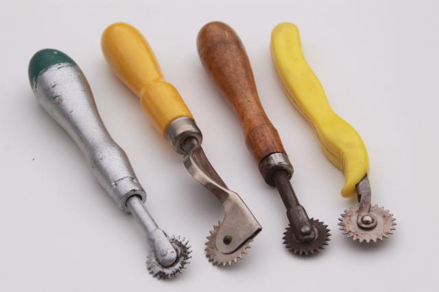 photo of vintage sewing tools, collection of old pattern tracing wheels or pounce wheels #6