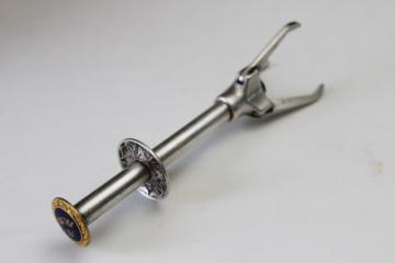 catalog photo of vintage silver plate sugar cube tongs or olive grabber, made in Sweden three crowns blue & gold 