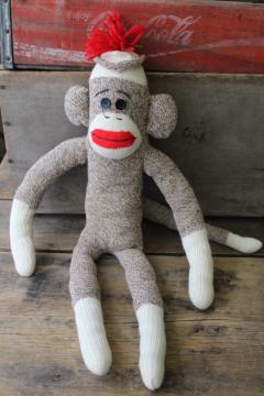 catalog photo of vintage sock monkey doll, stuffed toy Rockford red heel cotton work socks