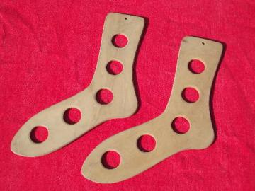 catalog photo of vintage sock stretchers, primitive wood feet for drying knit wool socks