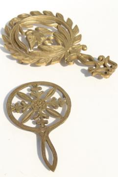 catalog photo of vintage solid brass trivets for colonial style fireplace hearth or country kitchen