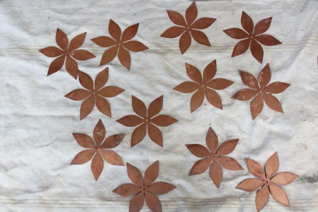 photo of vintage solid copper sheet cut out flowers, flat starburst art shapes w/ center hole #1