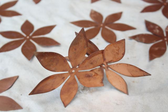 photo of vintage solid copper sheet cut out flowers, flat starburst art shapes w/ center hole #4