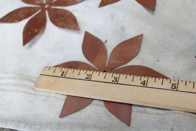 photo of vintage solid copper sheet cut out flowers, flat starburst art shapes w/ center hole #5