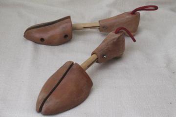 catalog photo of vintage stretchers for shoes, wooden shoe forms, pair of old wood feet shoe trees