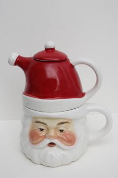 catalog photo of vintage style Christmas teapot & cup for one, Santa face mug w/ red hat pot on head