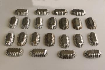 catalog photo of vintage tart pans or cookie molds, fluted metal tins w/ ladyfinger shape