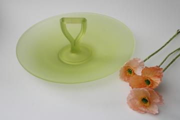 photo of vintage uranium glass, glowing vaseline glass plate w/ center handle, art deco serving tray