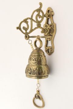 catalog photo of vintage wall mount doorbell or call bell, pull chain solid brass bell w/ hanging bracket