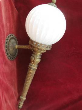 catalog photo of vintage wall sconce light, ornate gold torch lamp w/ glass globe shade