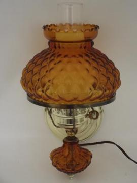 catalog photo of vintage wall sconce reading light, quilted amber glass lamp body and shade