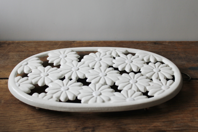 photo of vintage white enameled cast iron trivet, large oval w/ daisies, retro mod or cottagecore #1