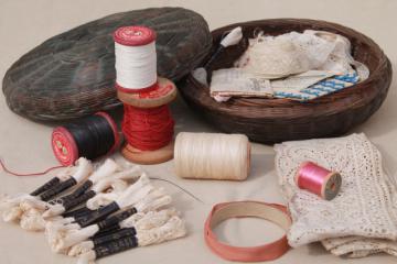 catalog photo of vintage wicker sewing basket full of antique lace & trims, spools of cord thread