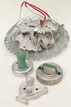 catalog photo of vintage wire basket full of old metal cookie cutters, country farmhouse kitchenware