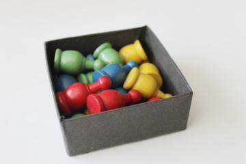 photo of vintage wood game parts, markers or playing pieces red blue yellow green