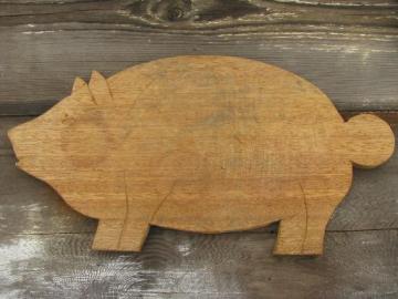 catalog photo of vintage wood pig kitchen board, primitive old cutting or breadboard