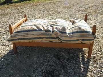 catalog photo of vintage wooden doll bed w/ old red & blue striped ticking feather bed pillow