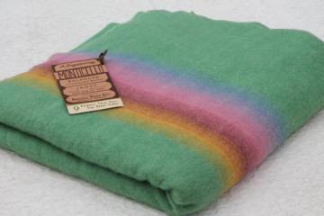 catalog photo of vintage wool blanket w/ original label Monticello Wisconsin, candy colored stripes on jade green