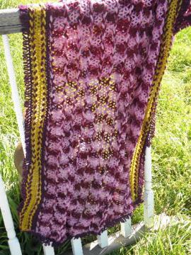 catalog photo of vintage wool hairpin lace throw or stole, shades of plum and amber gold