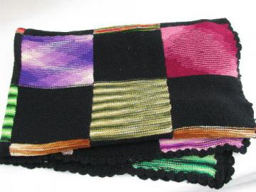 catalog photo of vintage wool lap blanket, knitted blocks in black w/ brights