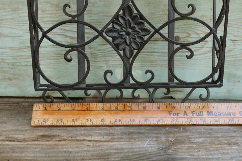 photo of vintage wrought iron magazine rack, heavy ornate black metal wall mount hanging storage #2