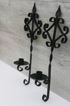 catalog photo of vintage wrought iron wall sconces, black metal wall hanging candle holders pair, old southwest style