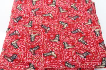 catalog photo of western boots on red bandana print cotton flannel fabric, cowboy / cowgirl dude ranch