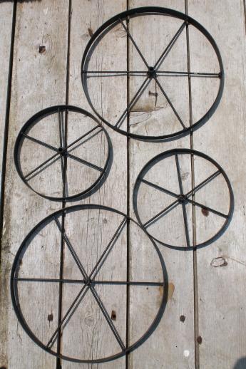 photo of western style wagon wheel set, metal wall art or primitive decorative wheels #1