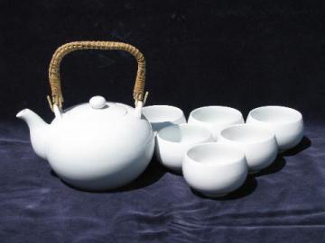 catalog photo of white porcelain oriental tea set, teapot w/ rattan handle, bowl cups