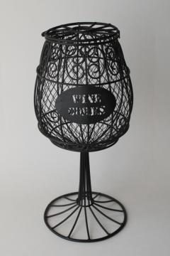 wine corks display, oversize wine glass black wire basket, arty vineyard bistro bar decor 