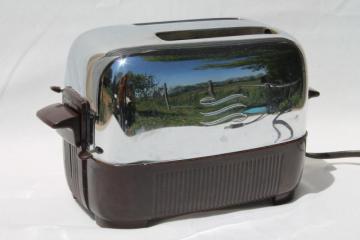 catalog photo of working 1950s vintage GE two slice toaster, brown bakelite & shiny silver chrome