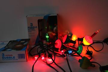 catalog photo of working NOMA replacement Christmas light bulbs in boxes, C7 large bubble lights