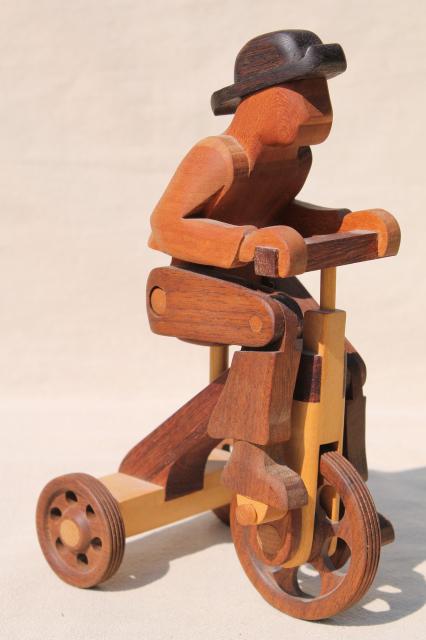 photo of working tricycle wooden toy, handmade wood folk art whimsy, man on wheels #1