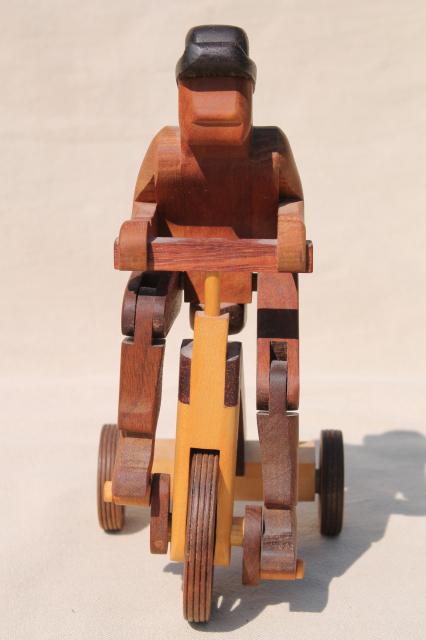 photo of working tricycle wooden toy, handmade wood folk art whimsy, man on wheels #3