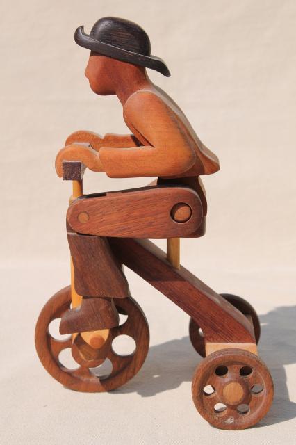 photo of working tricycle wooden toy, handmade wood folk art whimsy, man on wheels #4