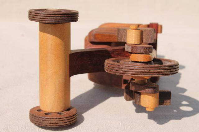 photo of working tricycle wooden toy, handmade wood folk art whimsy, man on wheels #7